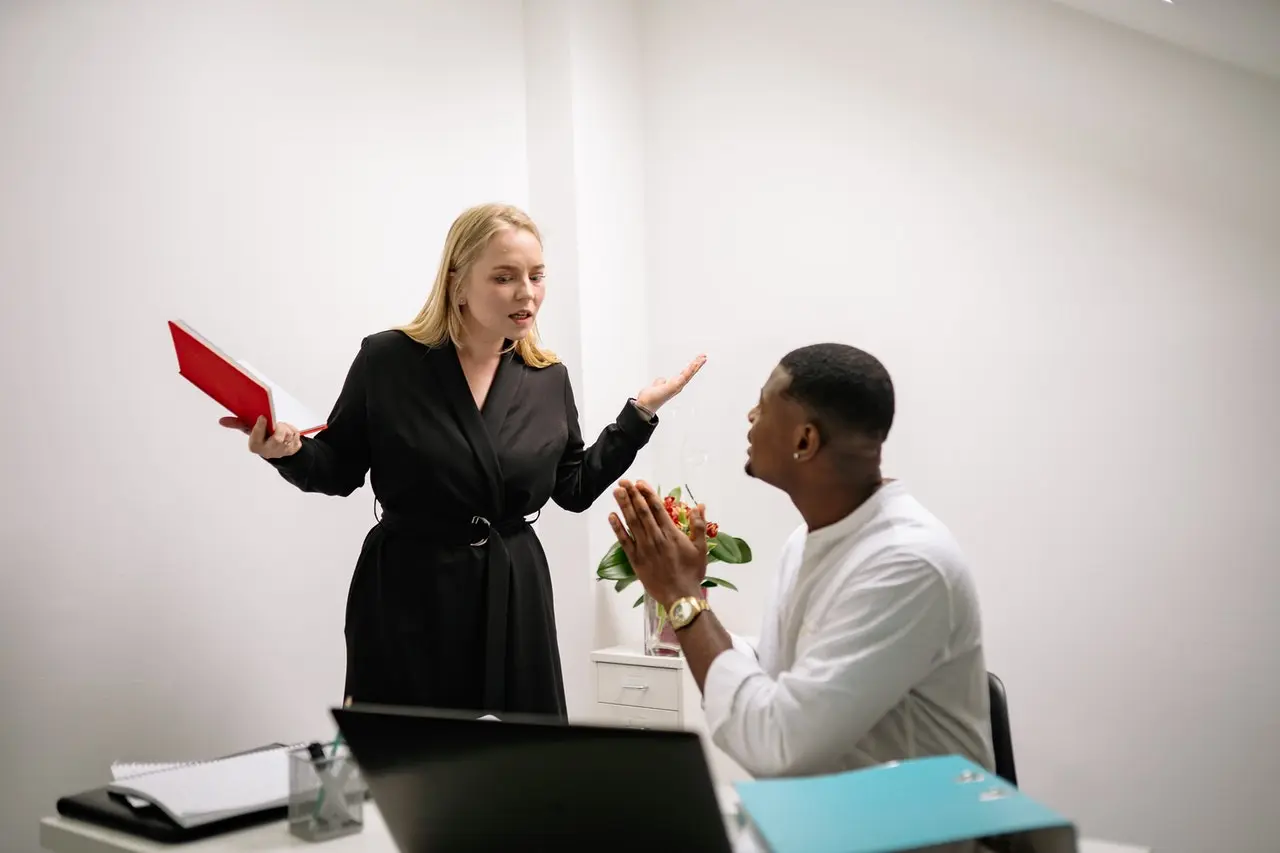A Man and Woman Having an Argument in a Workplace
