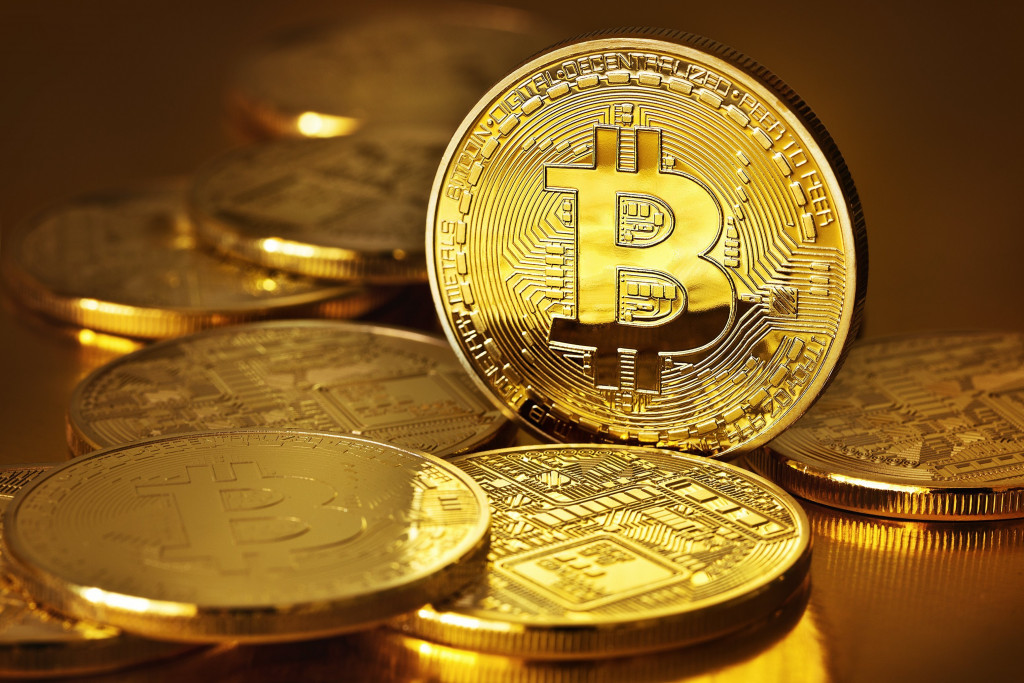 Golden Bitcoins on a gold background
