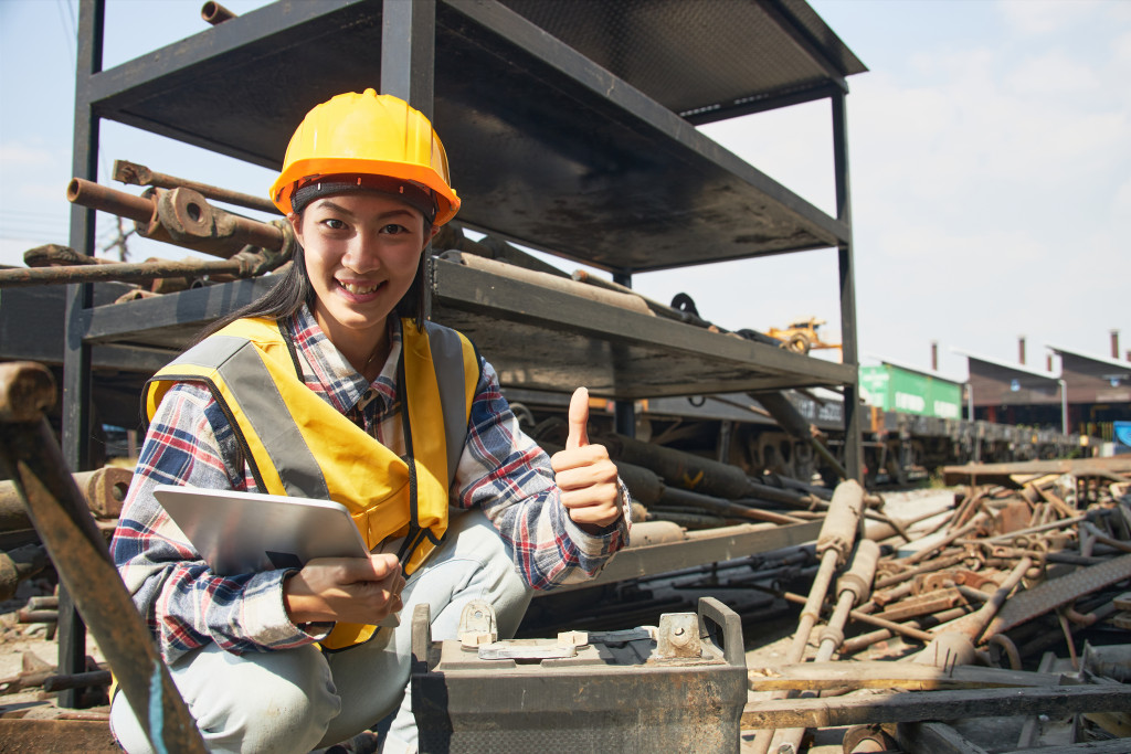 Female worker conducting a construction site inspection. 