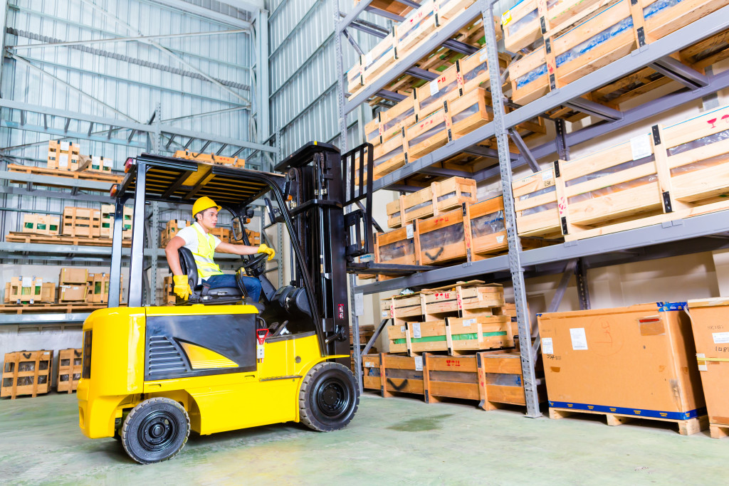 man operating an lift truck in the warehouse