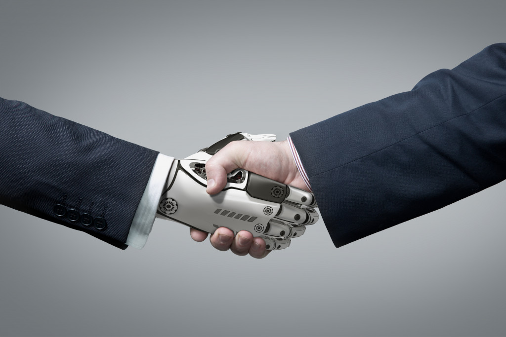a human and robot handshaking